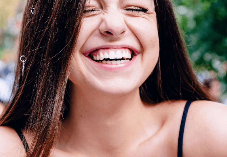 Woman smiling with dental implants in London