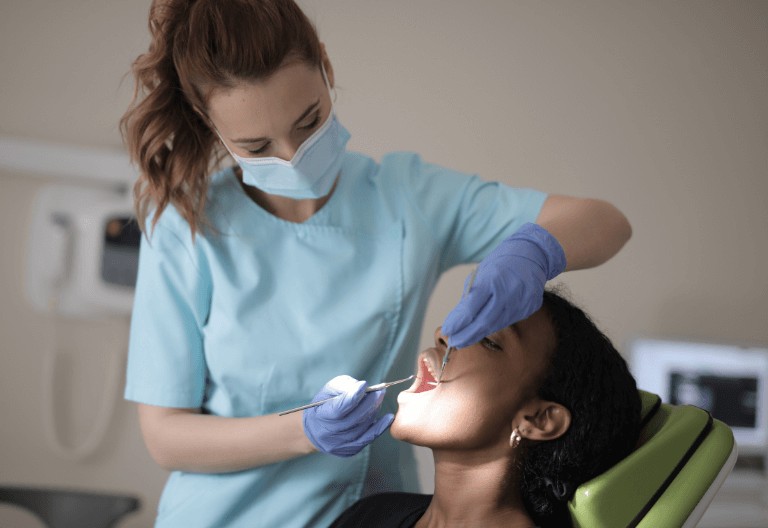 dentist carrying out dental implants in London