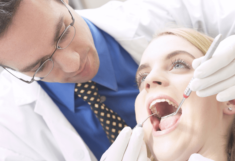 woman receiving emergency dental treatments in London