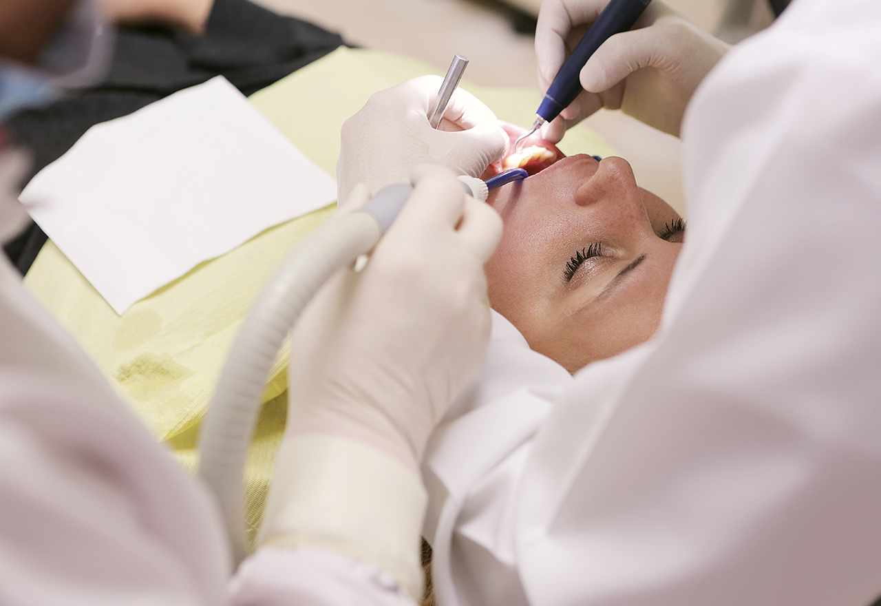 dental implant surgery being performed on woman in London