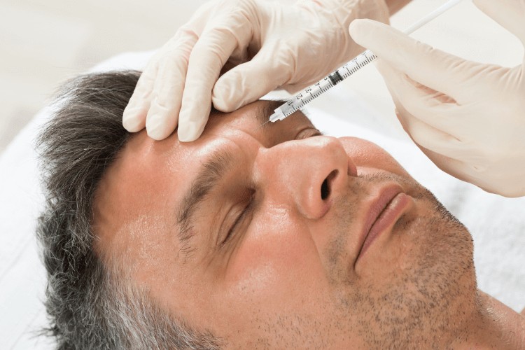 man receiving dermal fillers at our Clapham clinic