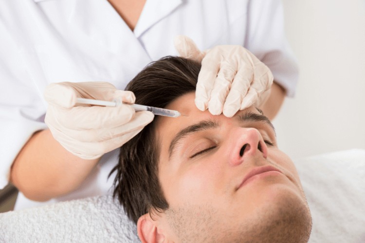 man receiving dermal fillers in Clapham
