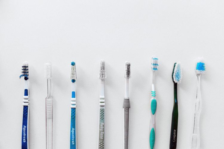 Different types of toothbrushes for oral hygiene lined up in Clapham dental practice