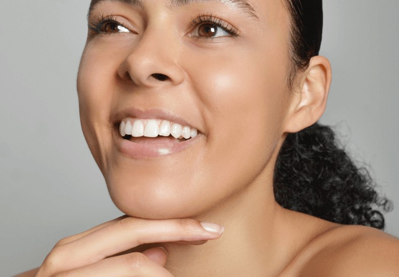 Woman with bruxism smiling in Clapham