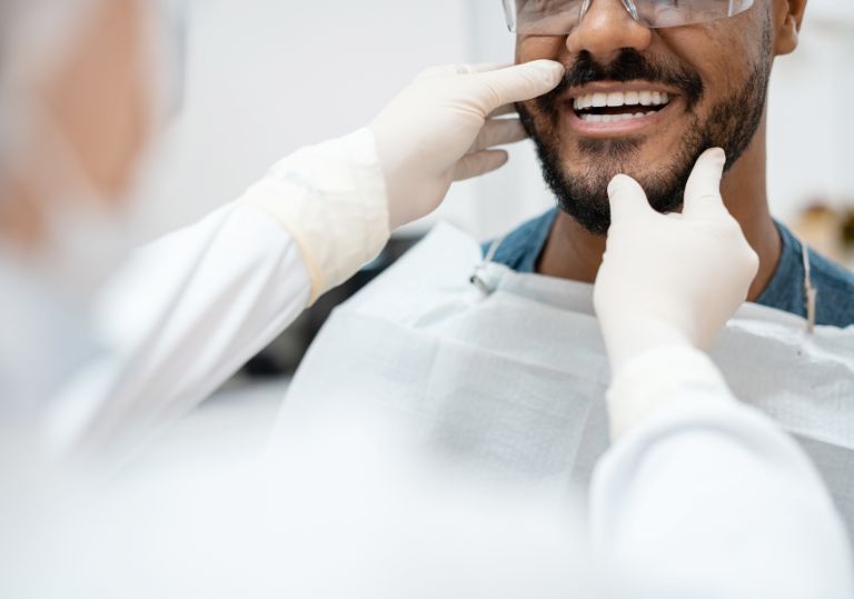Man during white fillings appointment at Clapham dental practice