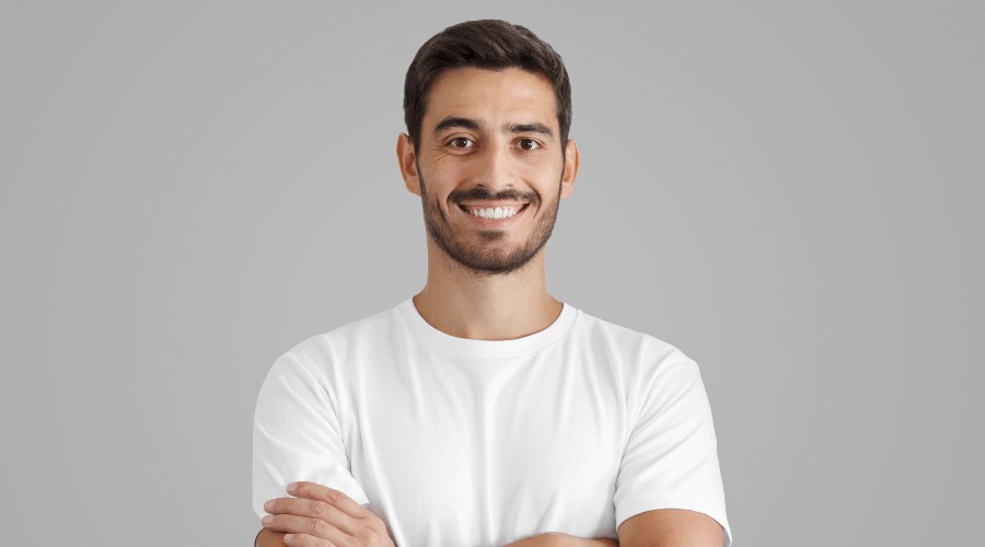 Man smiling at camera after having Dental Implants